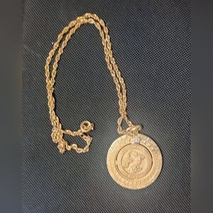 Capricorn Pierre Cardin 1 1/8 Round Spin Pendant With 18" Gold Tone Necklace